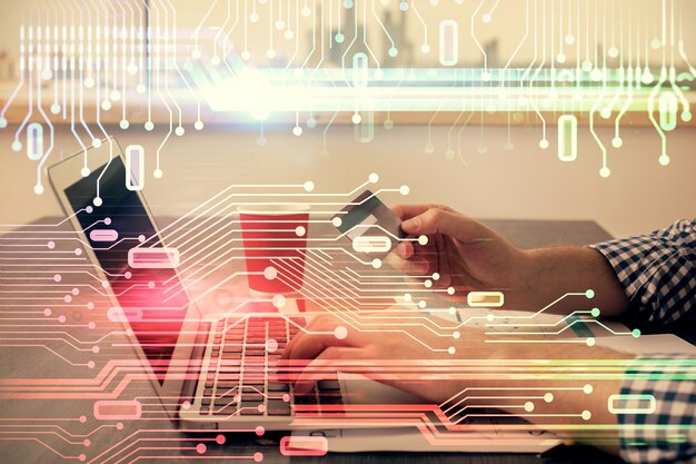 double exposure of man hands holding a credit card and data theme drawing ecommerce and technology concept