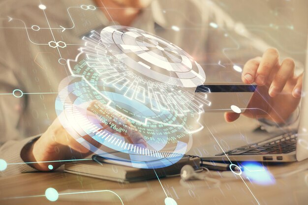 Double exposure of man hands holding a credit card and data theme drawing Ecommerce and technology concept