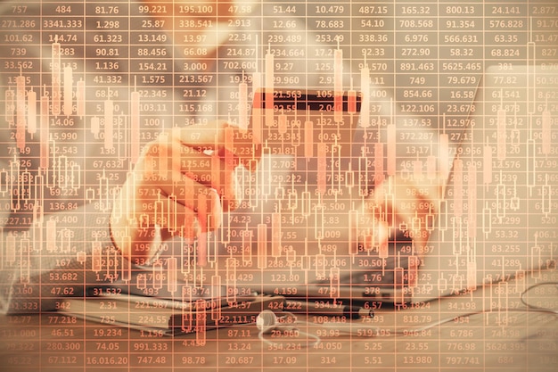 double exposure of man hands holding a credit card and forex graph drawing stock trading and digital fintech in internet ecommerce concept