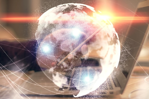 Double exposure of man's hands holding and using a phone and international business theme drawing