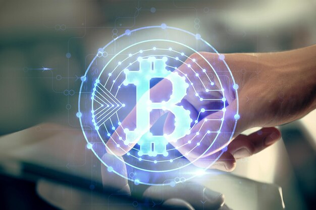 double exposure of mans hands holding and using a phone and crypto currency blockchain theme drawing