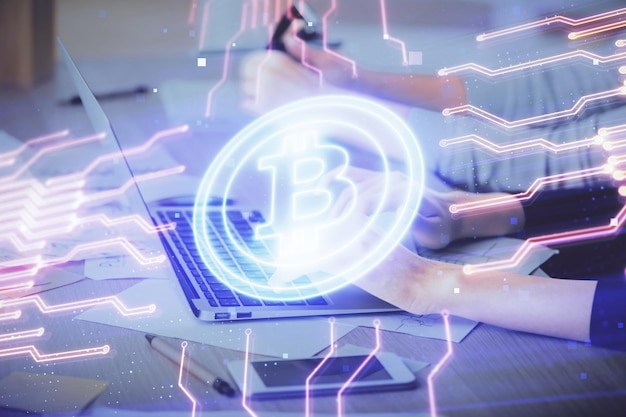 double exposure of woman hands typing on computer and crypto market theme hologram drawing blockchain concept