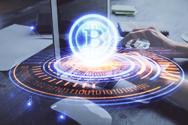 Double exposure of woman hands typing on computer and crypto market theme hologram drawing Blockchain concept