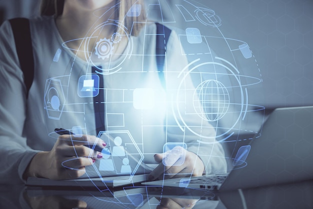 double exposure of woman hands typing on computer and social network theme hologram drawing people media concept