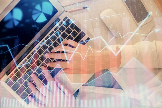 double exposure of woman hands working on computer and forex chart hologram drawing top view financial analysis concept