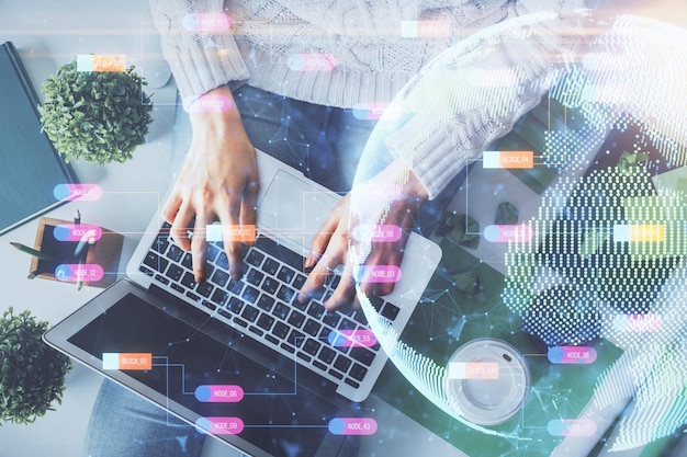 double exposure of woman hands working on computer and world map hologram drawing top view international business concept