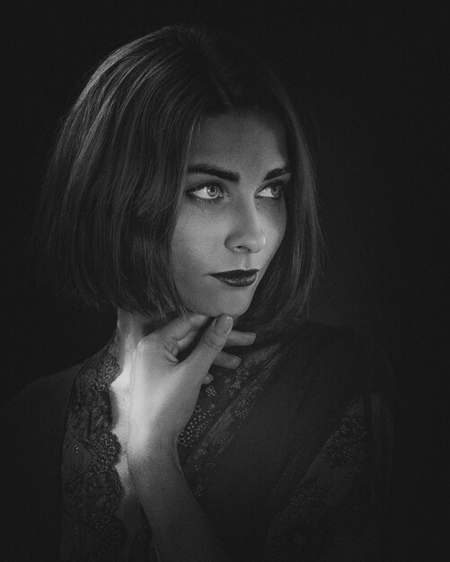 dramatic female portrait against dark backgrounds