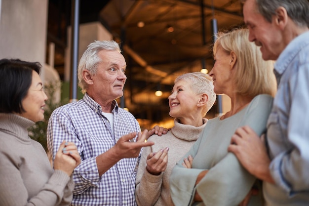 elderly friends discussing news