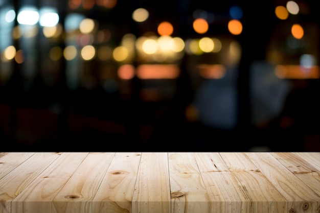 Empty wooden table platform and bokeh at night