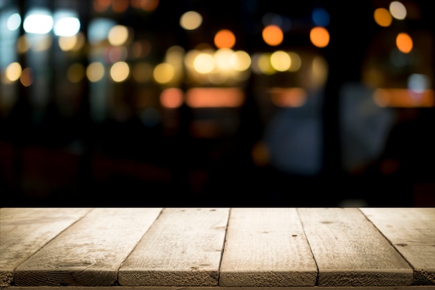 Empty wooden table platform and bokeh at night