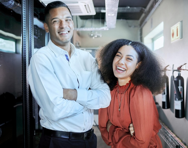 engineer cybersecurity and happy team together in a server room or data center for maintenance for cloud computing or information technology system it man and black woman happy about teamwork