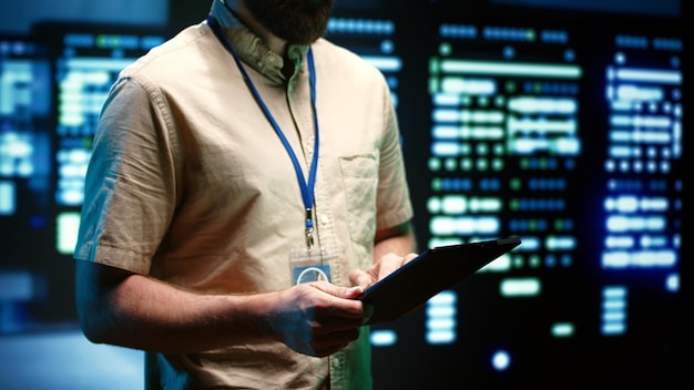 engineer inspecting server racks