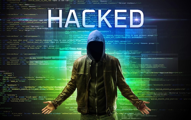 faceless hacker on code background