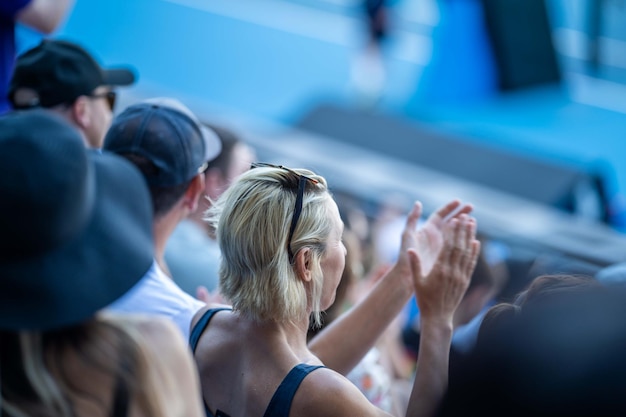 fans watching a sporting match and sporting event in a stadium