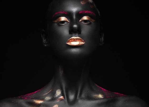 fashion portrait of a dark-skinned girl with color make-up. beauty face.