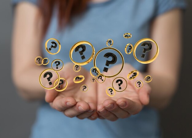 Female holding question mark bubbles