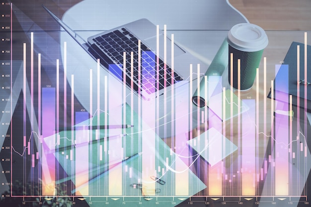 financial graph colorful drawing and table with computer on background double exposure concept of international markets