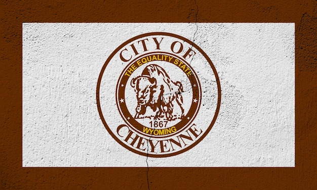 Flag of the city of Cheyenne Wyoming USA on a background of a cracked wall Conceptual collage