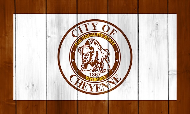 Flag of the city of Cheyenne Wyoming USA on a background of a wooden fence Conceptual collage