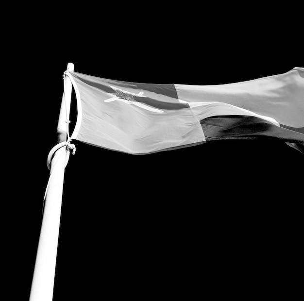 Flag waving against black background
