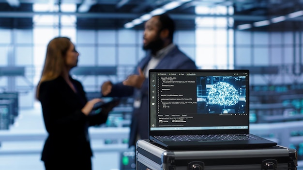 Focus on laptop used by server farm technicians