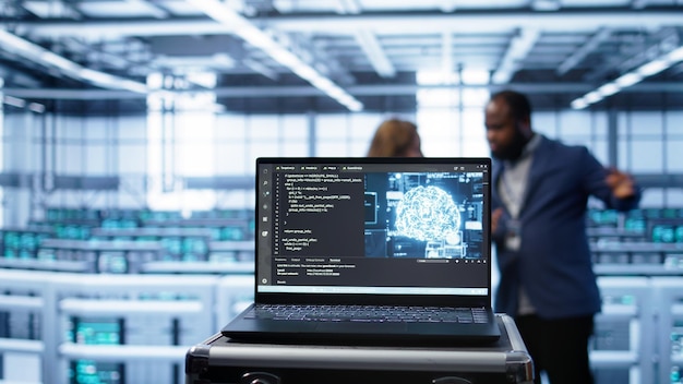 Focus on laptop used by server farm technicians