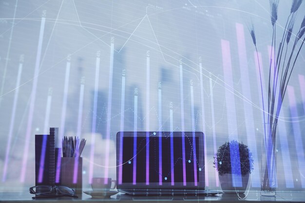 forex chart hologram on table with computer background multi exposure concept of financial markets