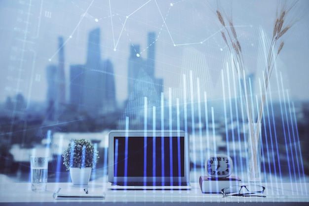 forex chart hologram on table with computer background multi exposure concept of financial markets