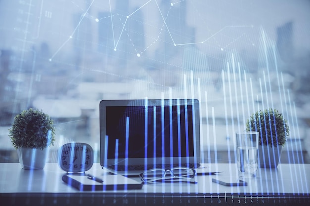 forex graph hologram on table with computer background multi exposure concept of financial markets