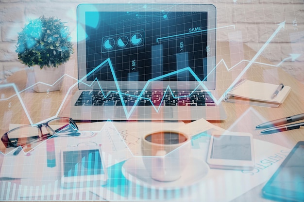 forex market graph hologram and personal computer on background multi exposure concept of investment