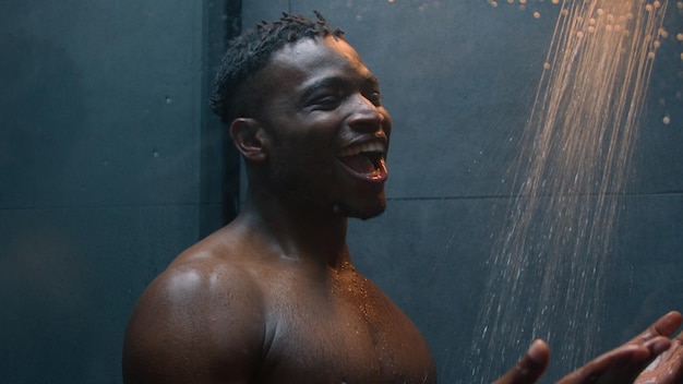 funny joyful man take shower washing body relax african american male ethnic happy guy singing song