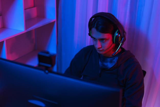 Game stream concept Male streamer wear headset to play games online for streaming on social media