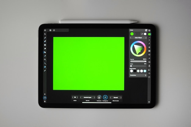 green background for digital art on tablet. remote freelance work. home creative education