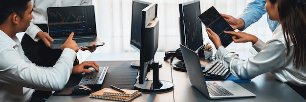 group of stock trading investor or business people discussing and analyzing financial data graph on stock market together in meeting room stock trading or exchange investment planning trailblazing