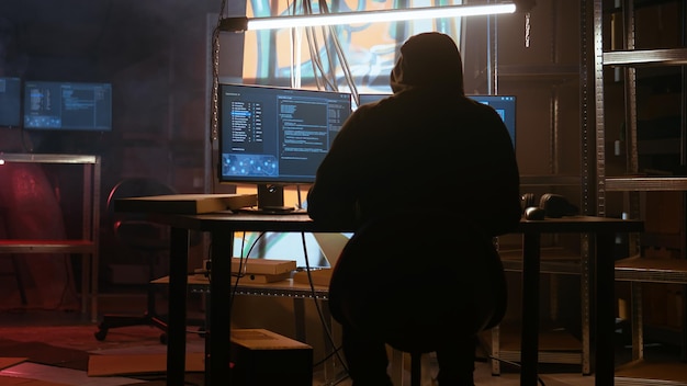 Hacker arriving in messy base of operations with neon lights and graffiti art