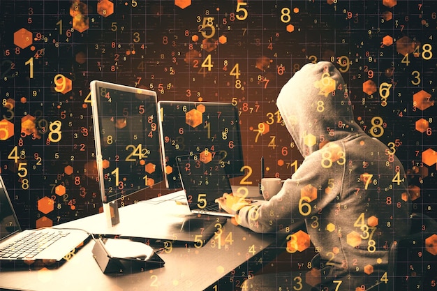 hacker at desktop using laptop with abstract digital big data interface ransomware and ai concept double exposure