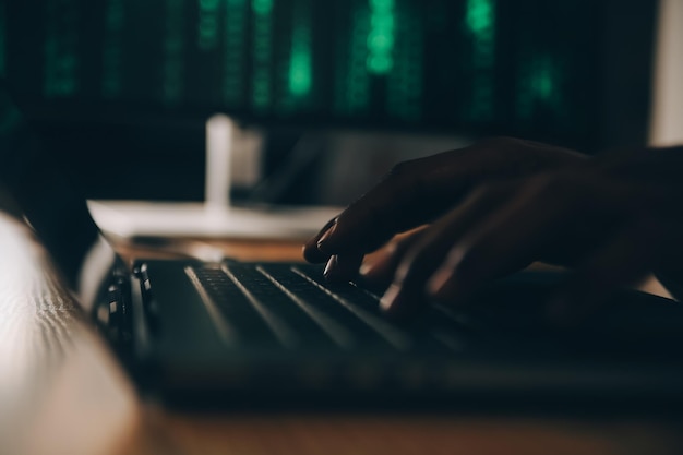 Hacker code in laptop Cyber security privacy or hack threat Coder or programmer writing virus software malware internet attack or developing digital design Green web data in computer screen