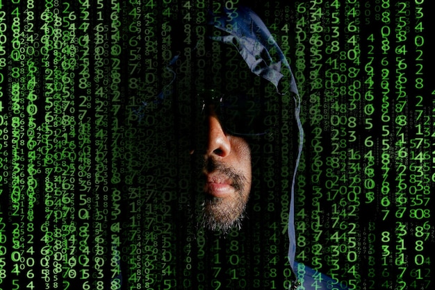 hacker concept hacker hood is a dangerous hacking and malware and computer virus identity theft and cybersecurity