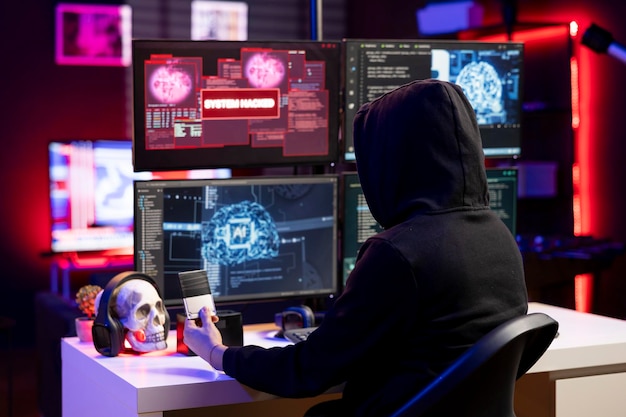 Hacker looking at ssd with malware on computer using it to break into systems and access restricted