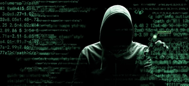 hacker prints a code on a laptop keyboard to break into a cyberspace