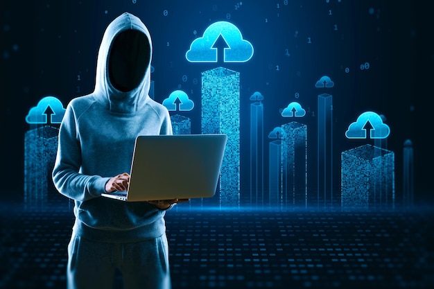 Hacker using laptop computer with creative cloud homputing hologram on blurry background Database hacking server and information storage concept