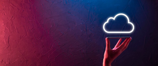 Hand holding icon cloud computing network and icon connection data information in hand. Cloud computing and technology concept.