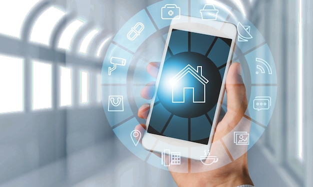 Hand of human holding smartphone with double exposure of smart home interface