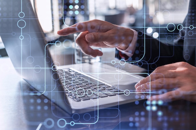 Hands typing the keyboard to create innovative software to change the world and provide a completely new service Close up shot Hologram tech graphs Concept of Dev team Formal wear