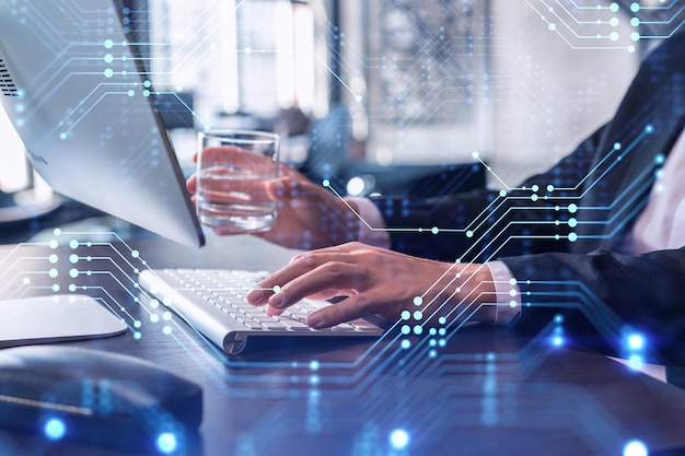 hands typing the keyboard to create innovative software to change the world and provide a completely new service close up shot hologram tech graphs concept of dev team formal wear