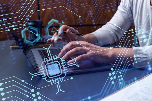 hands typing the keyboard to create innovative software to change the world and provide a completely new service close up shot hologram tech graphs concept of dev team