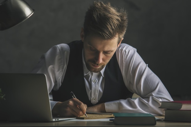 Handsome male worker doing paperwork