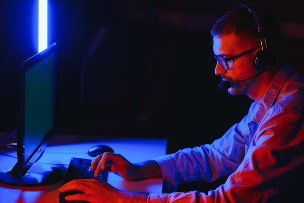 handsome young male software developer programming codes while working from home