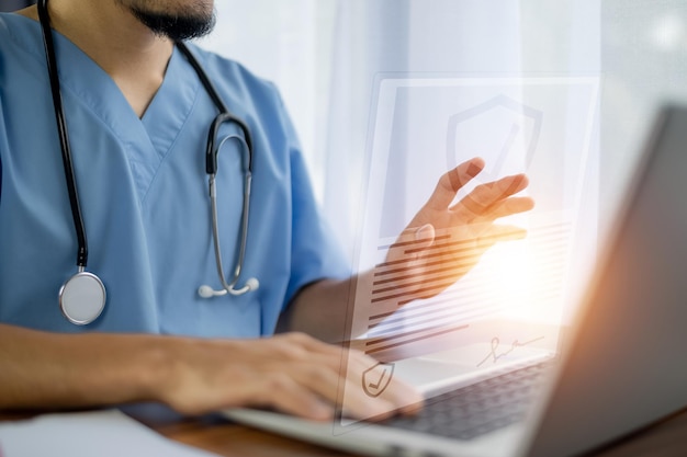 Health insurance Doctor working in office at hospital and visual screen technology concept life insurance medical and heal care insurance concept