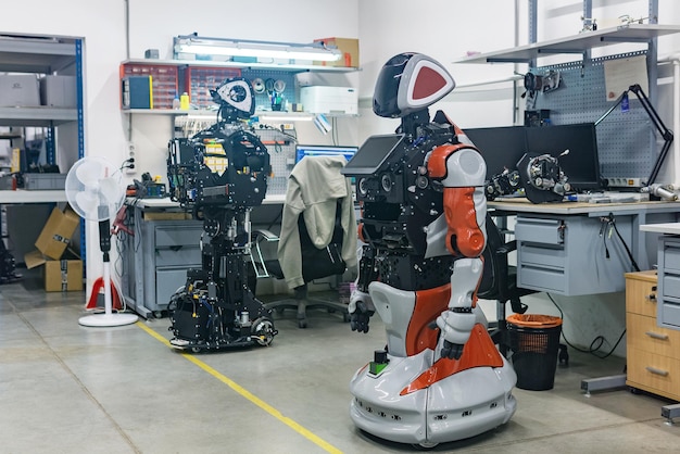 humanoid robots in the process of assembly and adjustment in the workshop